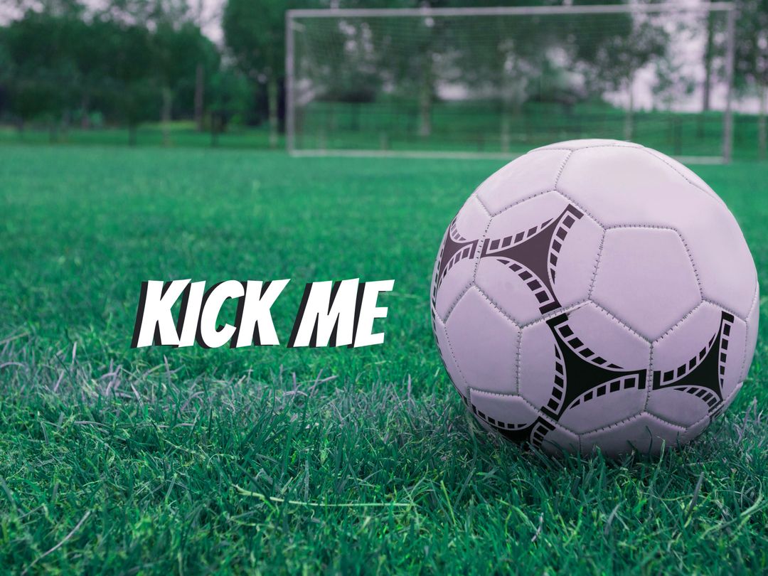 Soccer Ball with 'Kick Me' Text on Green Grass Field - Download Free Stock Templates Pikwizard.com