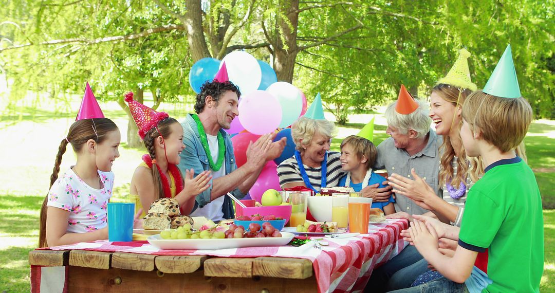 Family Celebrates Child's Birthday with Outdoor Picnic Party - Free Images, Stock Photos and Pictures on Pikwizard.com