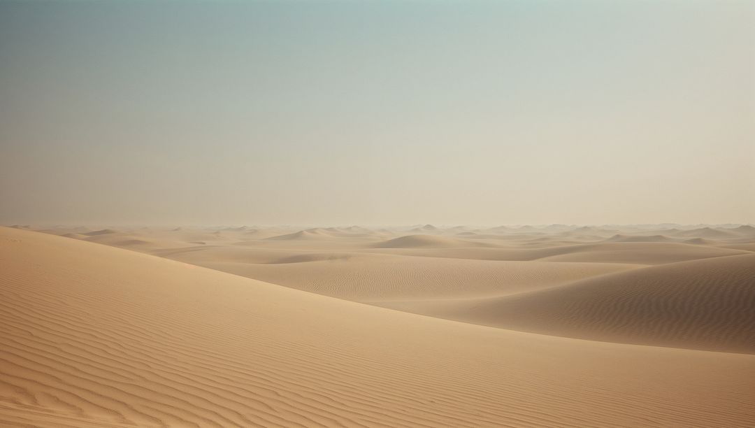 Endless Rolling Sand Dunes in a Vast Desert Landscape