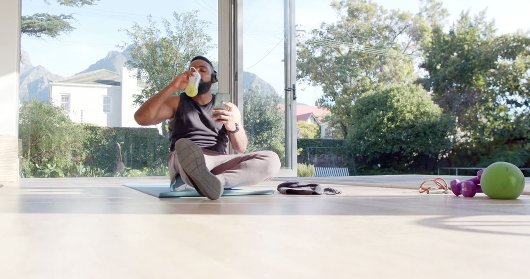 Man in Activewear Drinking Water During Home Workout - Free Images, Stock Photos and Pictures on Pikwizard.com