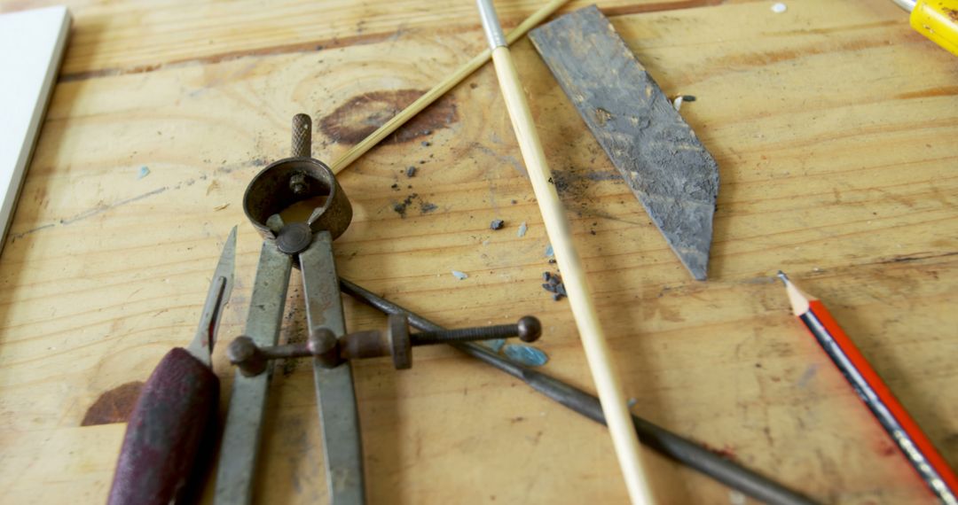 Close-up of Vintage Tools and Pencil on Wooden Workbench - Free Images, Stock Photos and Pictures on Pikwizard.com