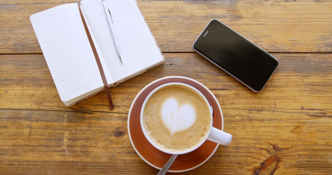 Coffee Cup, Notebook, and Smart Phone on Wooden Table - Free Images, Stock Photos and Pictures on Pikwizard.com