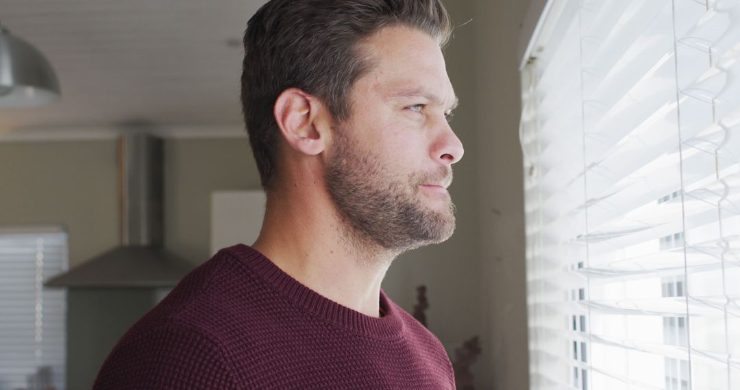 Image of thoughtful caucasian man drinking coffee and looking outside window - Free Images, Stock Photos and Pictures on Pikwizard.com