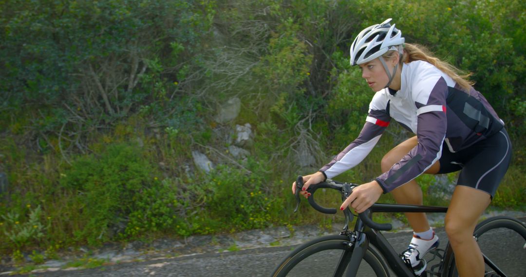 Female Cyclist On Road Bike During Workout - Free Images, Stock Photos and Pictures on Pikwizard.com