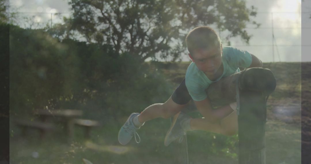 Energetic Boy Overview An Obstacle in Outdoor Field Setting