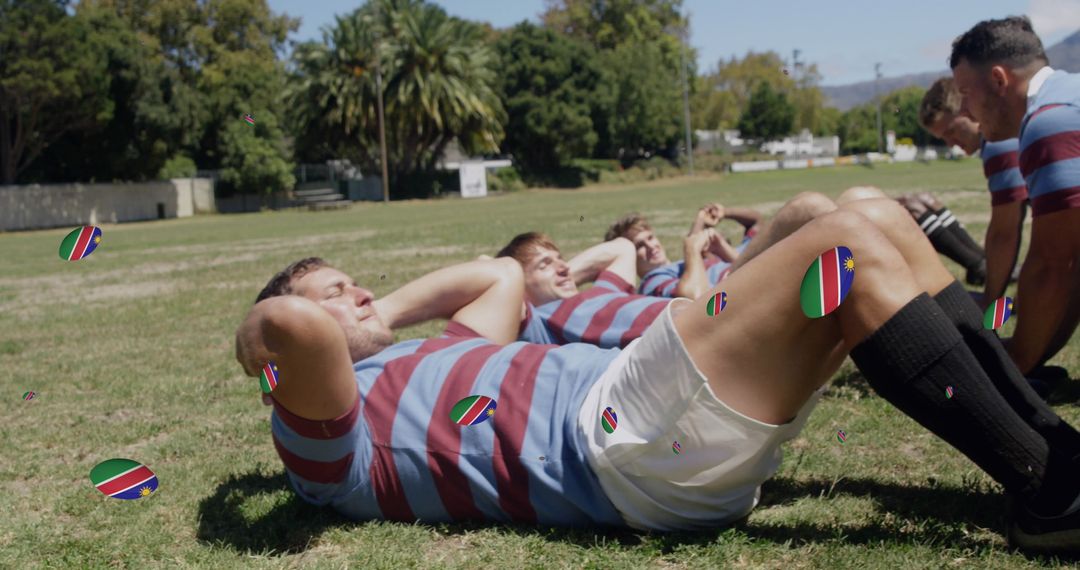 Rugby Players Exercising on Field with Namibian Flags
