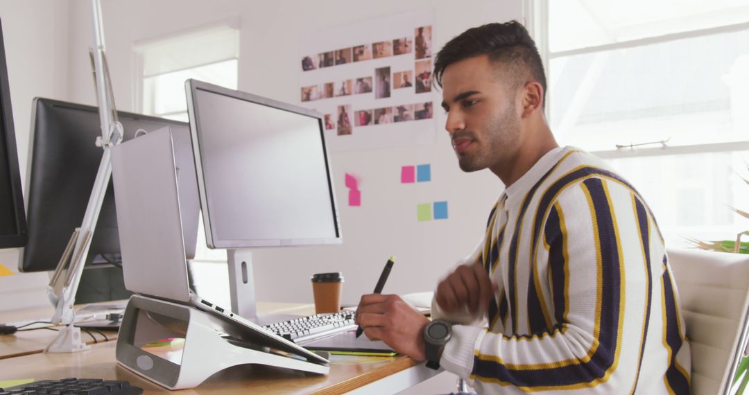Focused Work of Young Asian Professional in Modern Office
