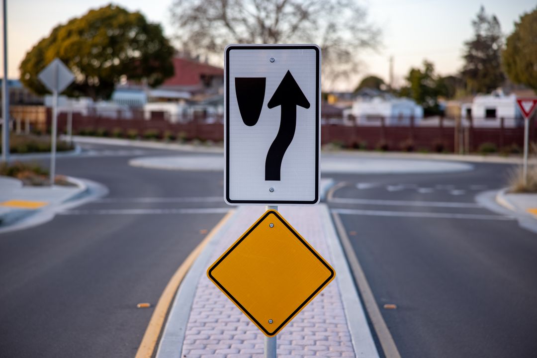 Traffic Diverge and Yield Signs on Quiet Suburban Street