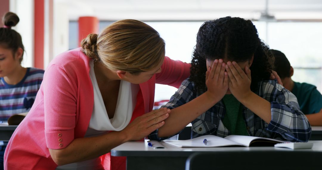 Teacher Comforting Sad Student During Class - Free Images, Stock Photos and Pictures on Pikwizard.com