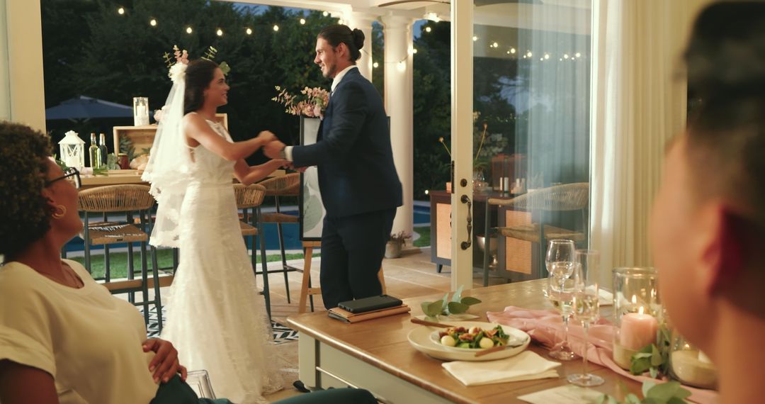 Bride and Groom Dancing During Reception with Dining Guests