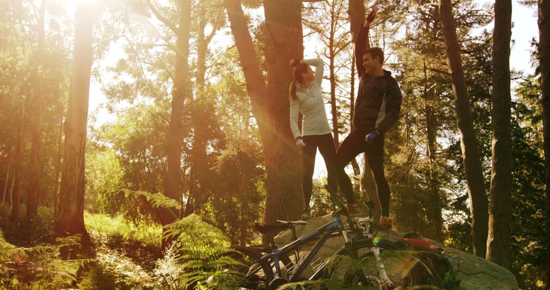 Couple Enjoying Scenic Forest Walk with Bicycles - Free Images, Stock Photos and Pictures on Pikwizard.com