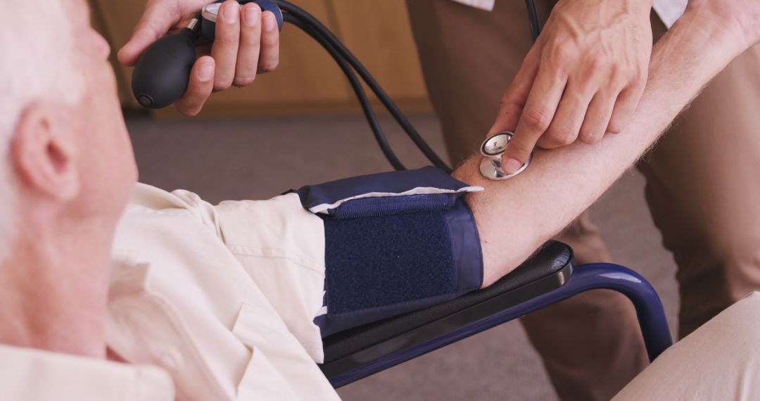 Health Professional Checking Elderly Patient's Blood Pressure - Free Images, Stock Photos and Pictures on Pikwizard.com