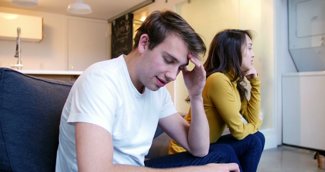 Stressed Couple Arguing and Sitting Apart in Home Conflict - Free Images, Stock Photos and Pictures on Pikwizard.com