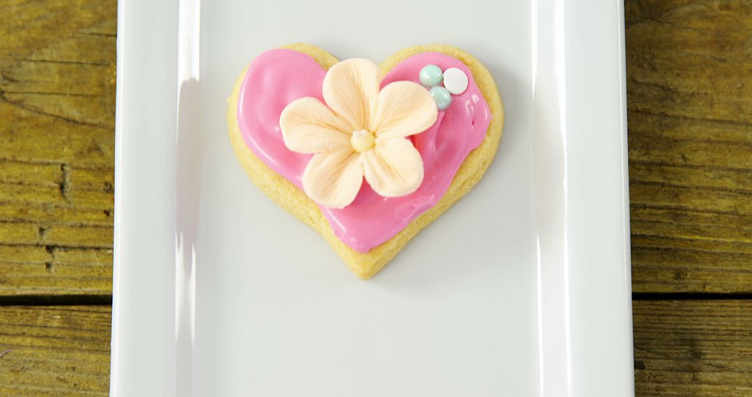 Heart-Shaped Cookie with Pink Icing and Decorative Flower - Free Images, Stock Photos and Pictures on Pikwizard.com