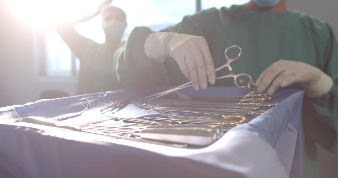 Surgeon Preparing Surgical Instruments in Theater