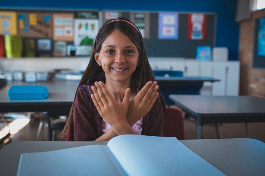 Smiling Schoolgirl with Hand Gesture Enthusiastic About Learning