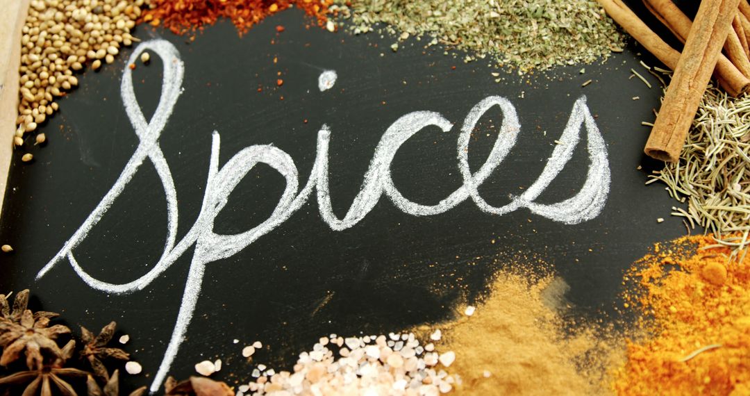 A chalkboard with spices in cursive displays a vibrant selection of culinary spices. - Free Images, Stock Photos and Pictures on Pikwizard.com