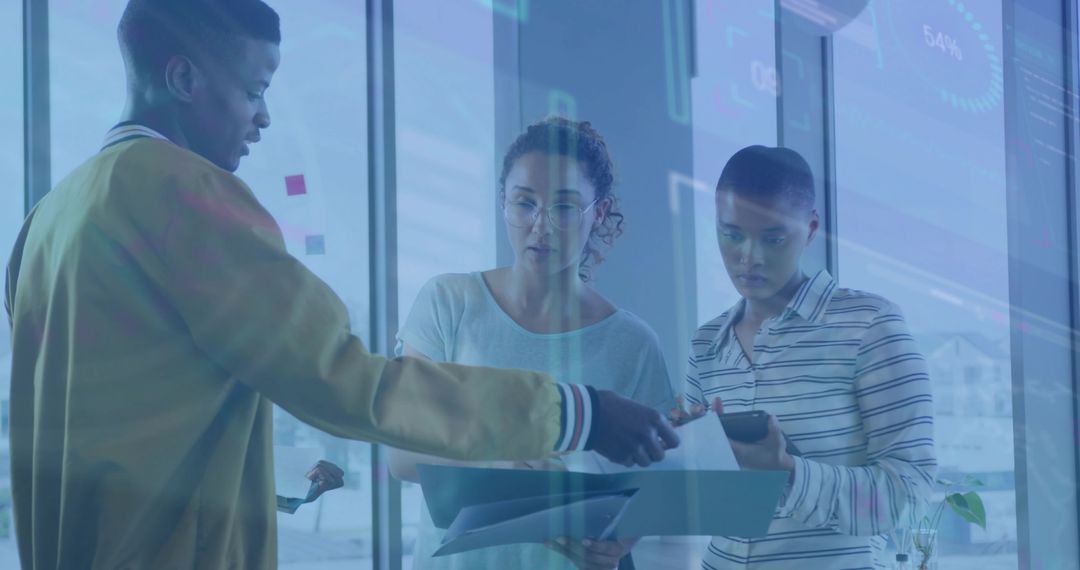 Colleagues Analyzing Data in Modern Office with Digital Interface Overlay