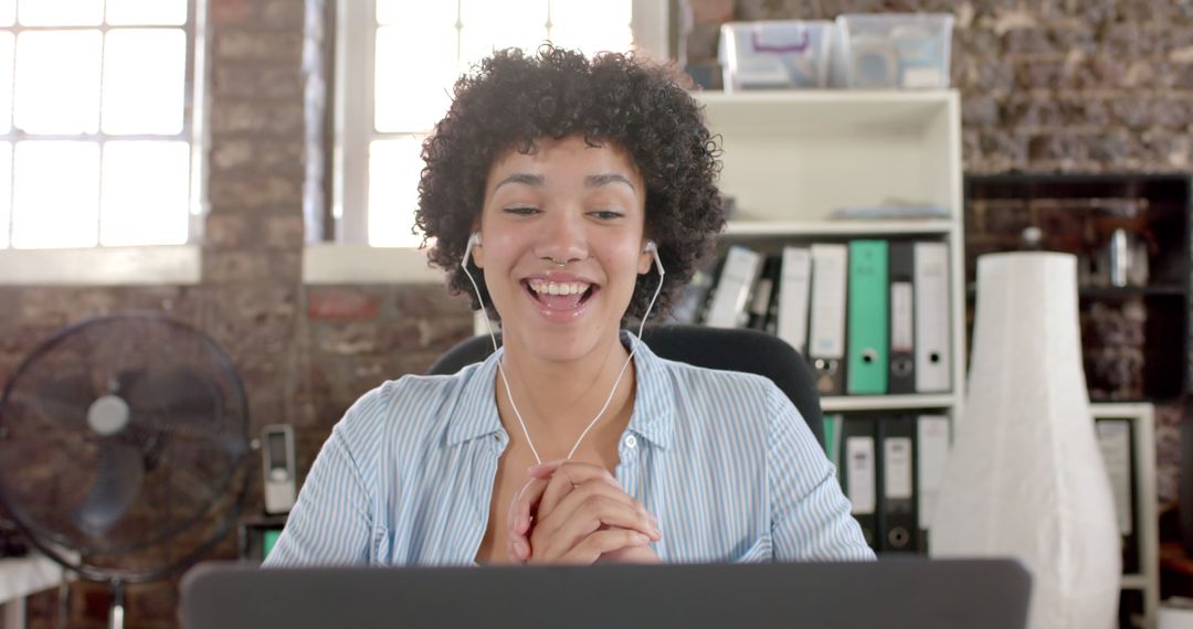 Young Woman Smiling During Video Call In Office - Free Images, Stock Photos and Pictures on Pikwizard.com