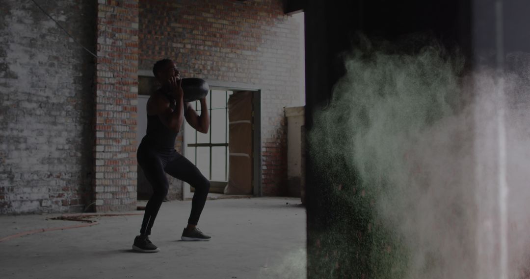 Athlete Exercising with Medicine Ball and Colorful Dust Explosion