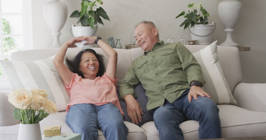 Happy Senior Couple Enjoying Leisure Time at Home