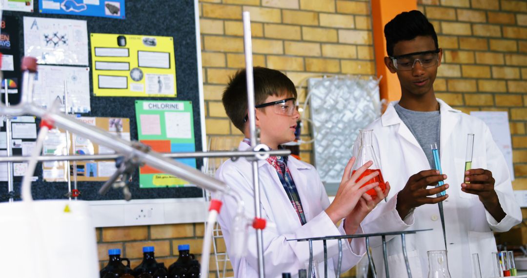 Students Conducting Chemistry Experiment in Classroom Laboratory - Free Images, Stock Photos and Pictures on Pikwizard.com