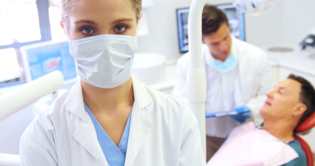 Female Dentist Wearing Mask in Modern Dental Clinic - Free Images, Stock Photos and Pictures on Pikwizard.com