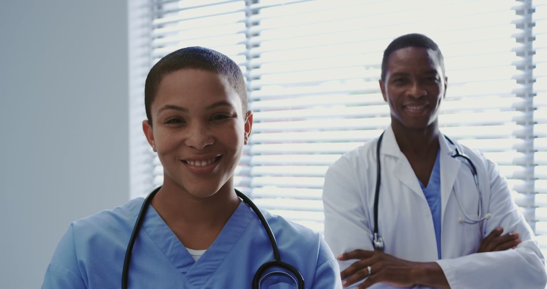 Smiling Medical Professionals Working in a Hospital - Free Images, Stock Photos and Pictures on Pikwizard.com