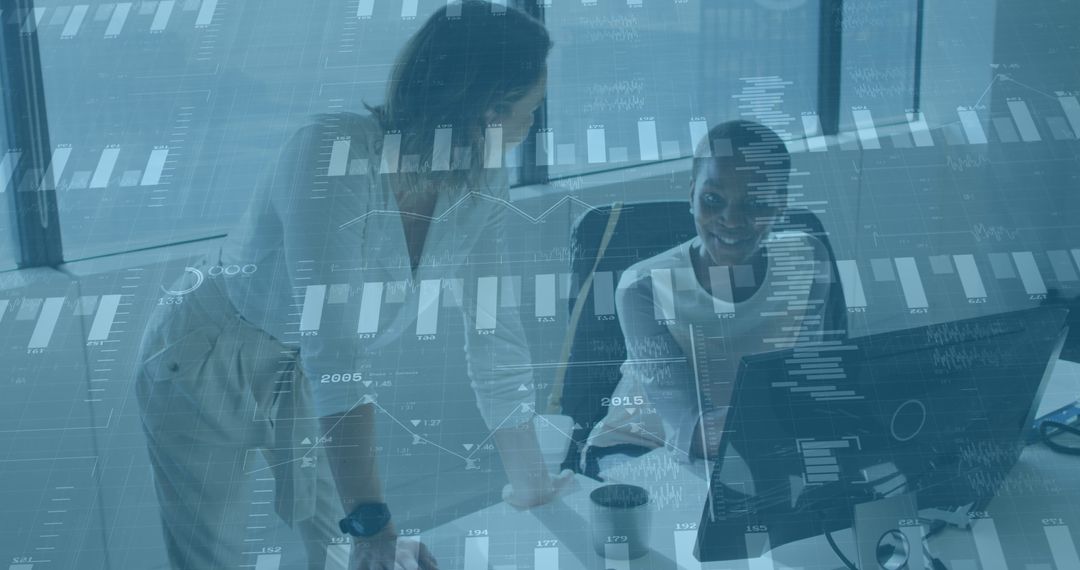 Diverse Female Colleagues Analyzing Financial Data on Computer