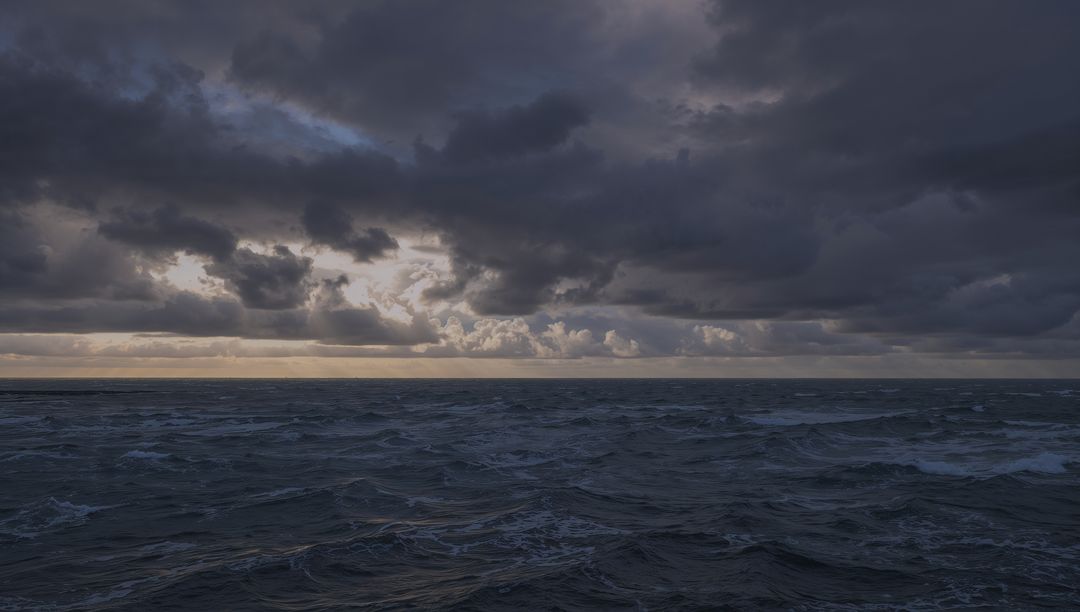 Moody Seascape with Dramatic Clouds and Reflective Waves