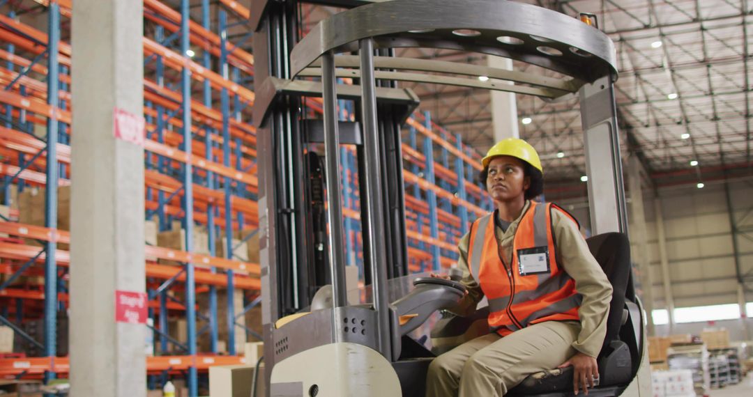 Female Forklift Operator Navigating Warehouse Aisle Wearing Hi-Vis Vest and Hard Hat