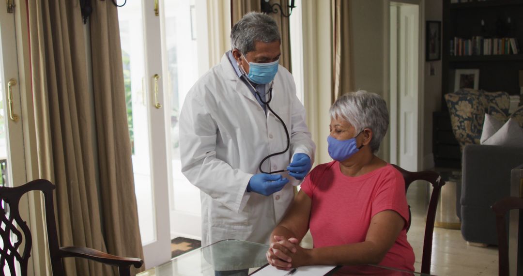 Doctor Using Stethoscope to Examine Senior Woman During Home Visit - Free Images, Stock Photos and Pictures on Pikwizard.com