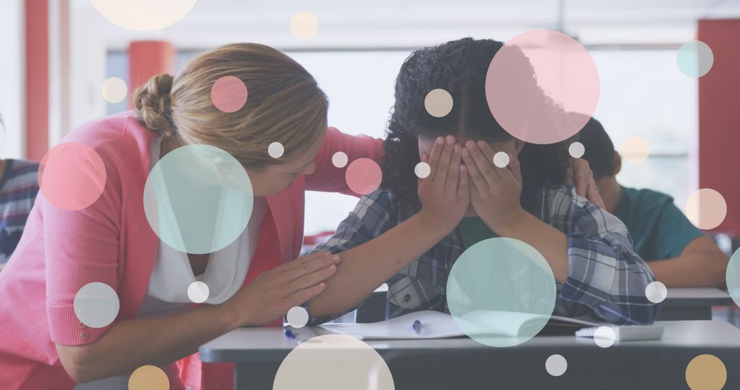 Teacher Providing Support to Distressed Student in Classroom