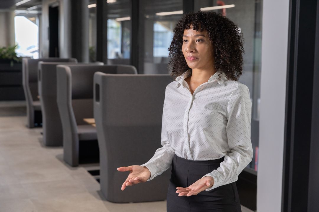 Professional Woman in Modern Office with Collaborative Spaces