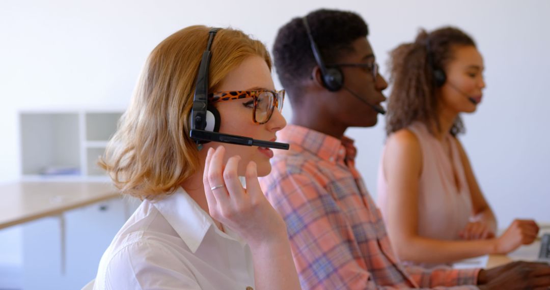 Diverse Customer Service Team Engaged in Office Communication