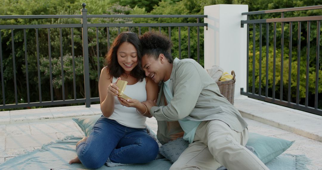 Loving Couple Enjoys Rooftop Picnic Laughing Together