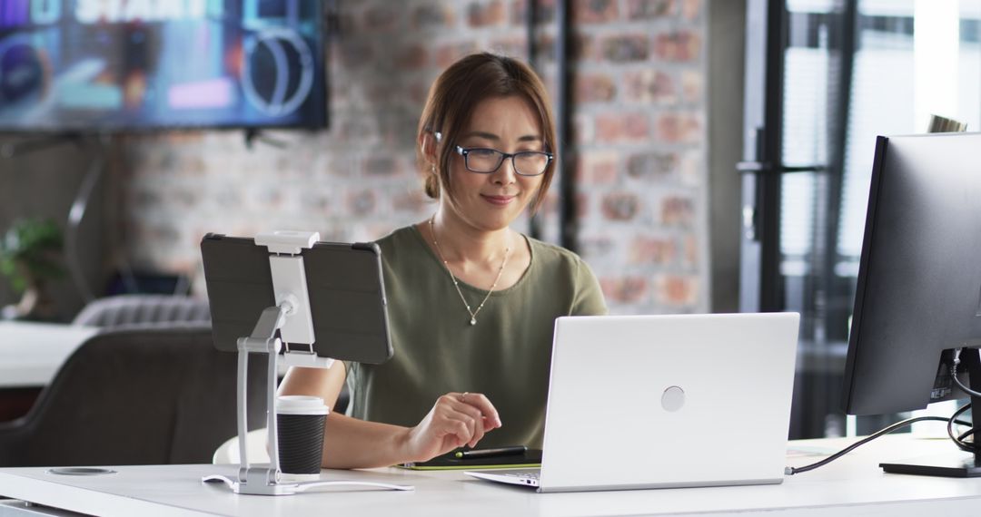 Senior Professional Engaged with Technology at Modern Office Desk