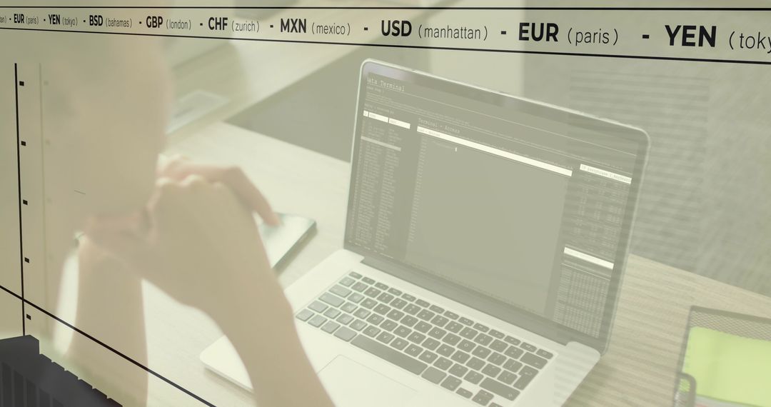 Woman Analyzing Financial Data on Laptop at Workspace