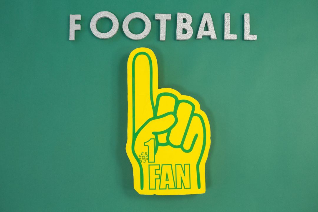 Foam Hand with Football Text on Green Background - Free Images, Stock Photos and Pictures on Pikwizard.com