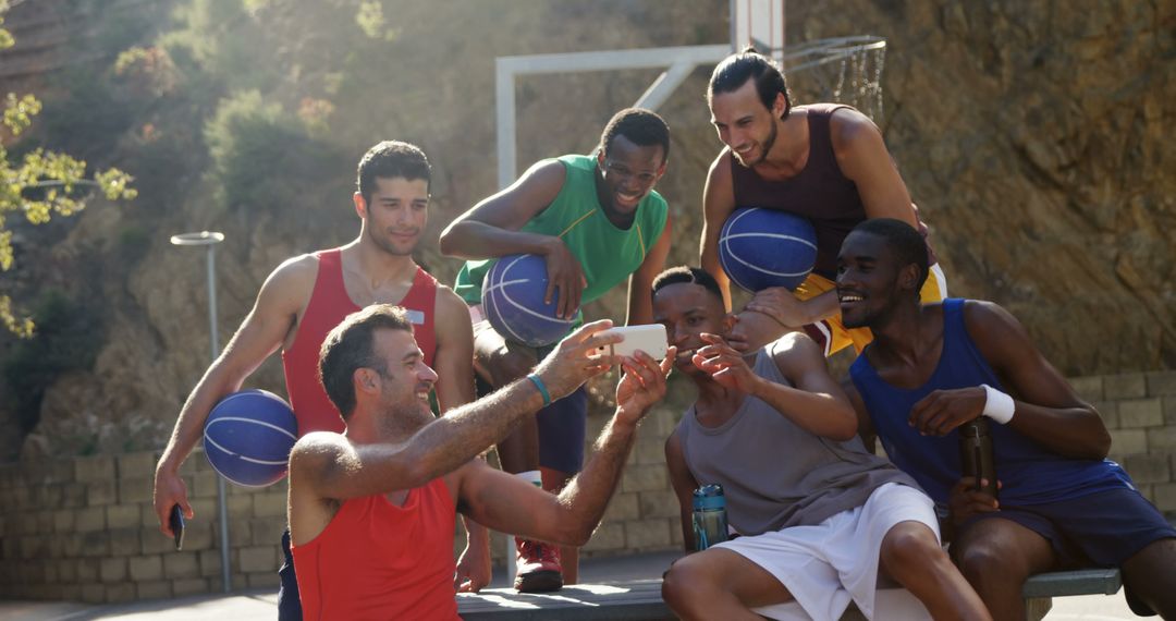 Group of Friends Taking Selfie on Outdoor Basketball Court - Free Images, Stock Photos and Pictures on Pikwizard.com