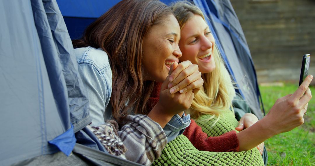 Friends Relaxing in Tent Taking Selfie Outdoors - Free Images, Stock Photos and Pictures on Pikwizard.com