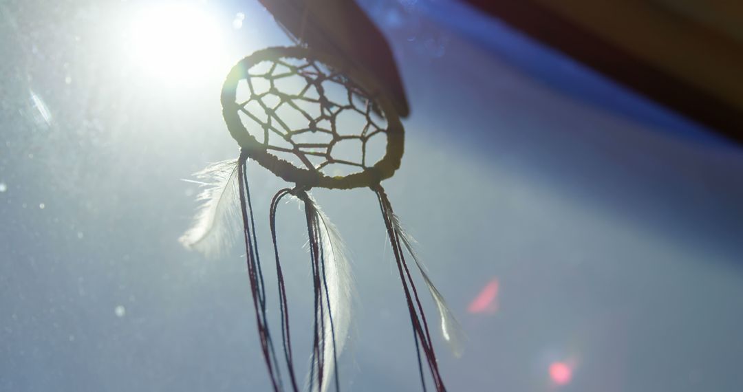 Dreamcatcher Hanging in Sunlight Through Window - Free Images, Stock Photos and Pictures on Pikwizard.com