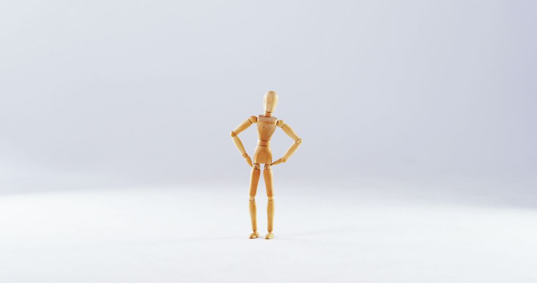 Wooden Poseable Mannequin Standing with Hands on Hips - Free Images, Stock Photos and Pictures on Pikwizard.com