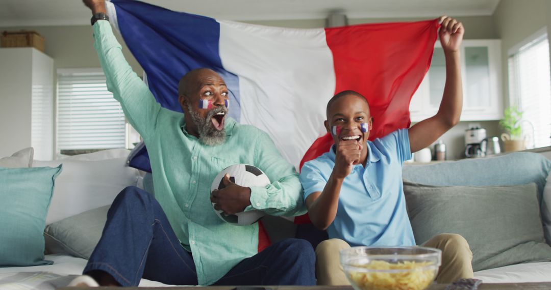 Image of african american father and son with flag of france watching match in tv - Free Images, Stock Photos and Pictures on Pikwizard.com