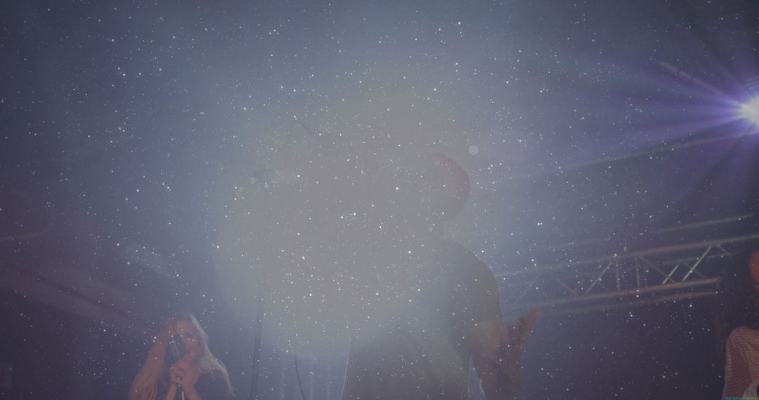 Band Performing Live on Stage with Captivating Light Effects