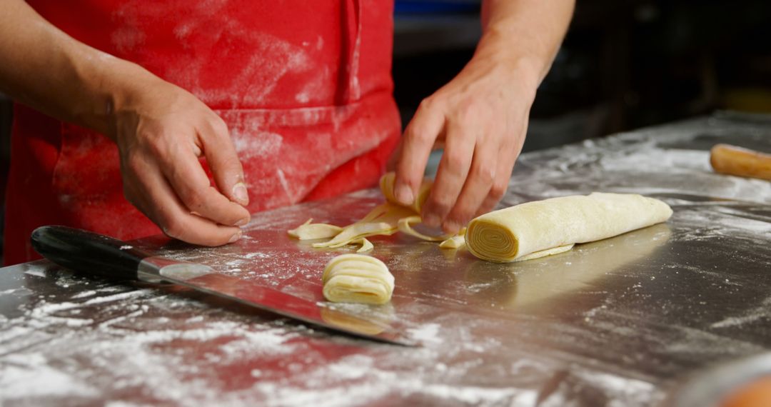 Chef Preparing Fresh Pasta on Floured Surface in Kitchen - Free Images, Stock Photos and Pictures on Pikwizard.com