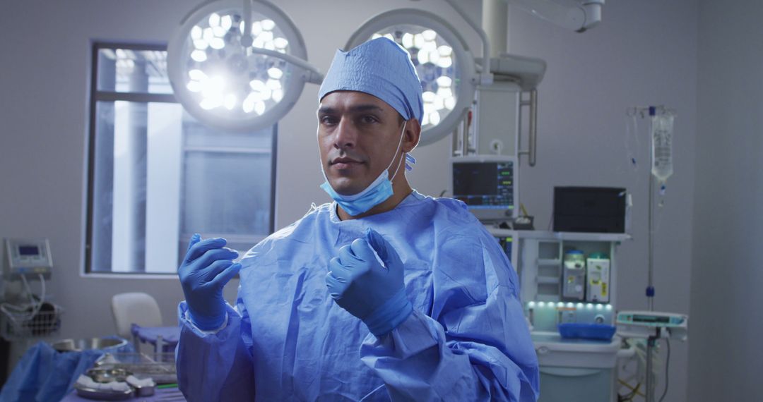 Smiling Biracial Male Surgeon in Operating Room During COVID-19 Pandemic - Free Images, Stock Photos and Pictures on Pikwizard.com