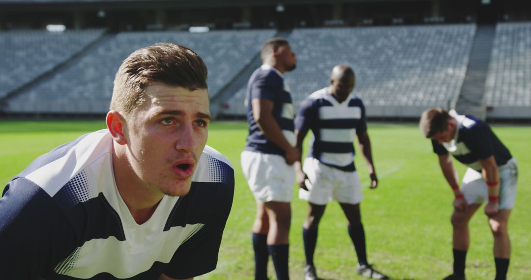 Rugby Team Taking a Break on Field - Free Images, Stock Photos and Pictures on Pikwizard.com