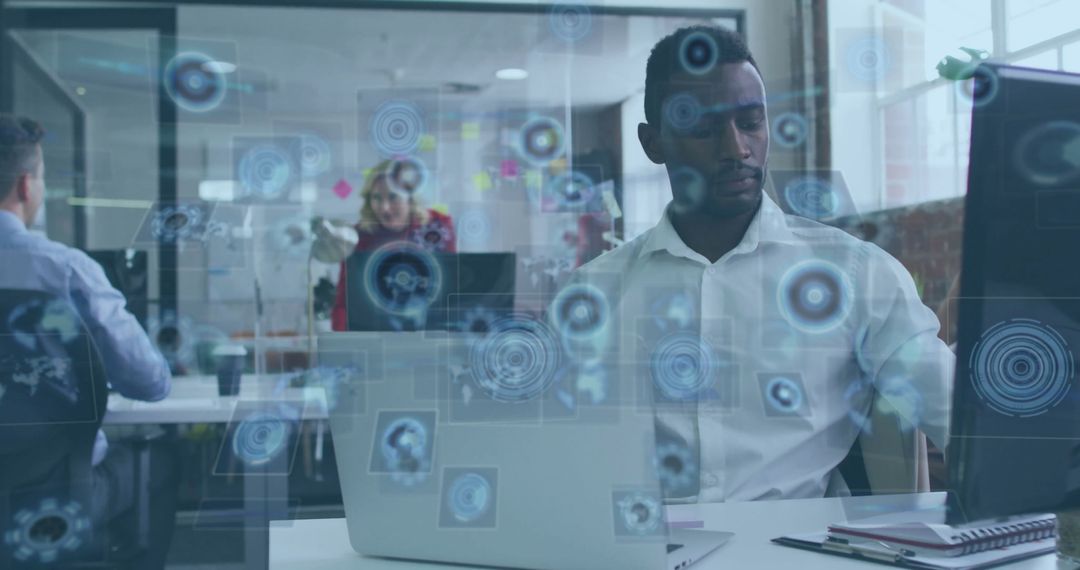 Focused Professional Working in Tech-Infused Office Environment