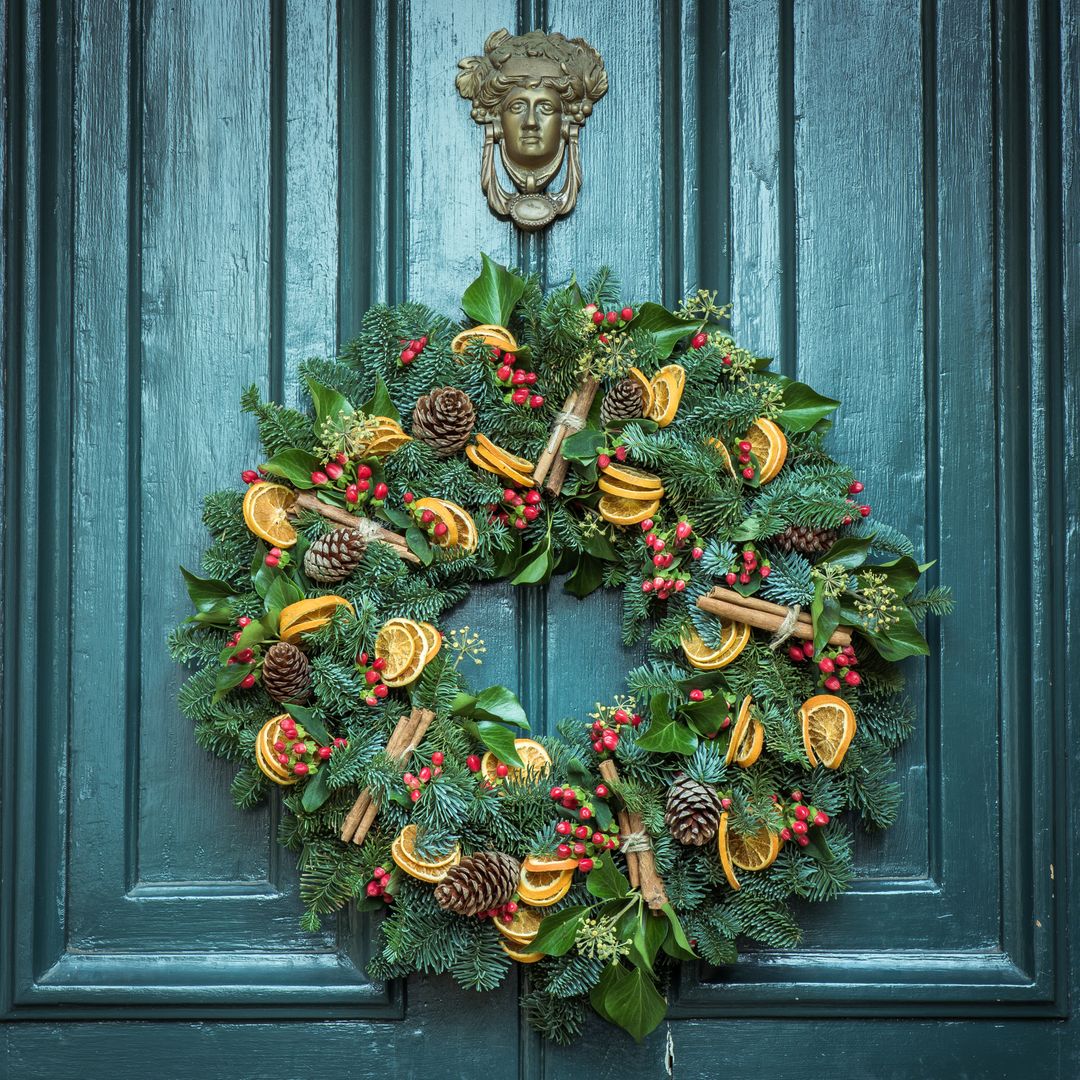 Traditional Holiday Wreath on Blue Door - Free Images, Stock Photos and Pictures on Pikwizard.com